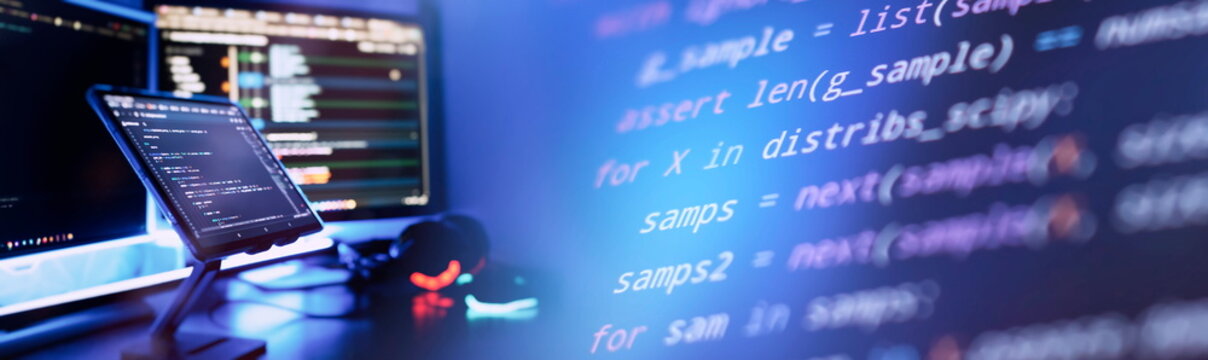 Work from home. Programmer coding code on notebook screen at home.