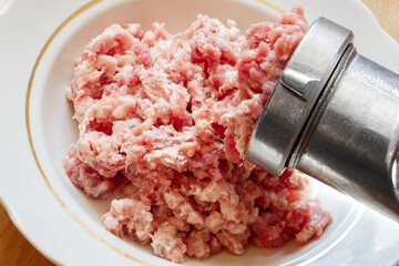Homemade minced meat close-up. Preparation of minced meat with a manual meat grinder.