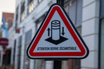 attention borne escamotable french text sign means road sign indicating caution retractable bollard
