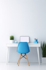 A minimalistic office mockup with a clean, white work desk, a pop of vibrant blue in the chair, and a colorful desk organizer.