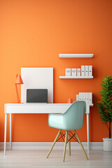 A mockup of a colorful office interior with a sleek white desk, a vibrant orange chair, and minimalist wall shelves.
