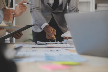 Finance manager meeting discussing company growth project success financial statistics, professional investor working start up project for strategy plan with document, laptop and digital tablet.