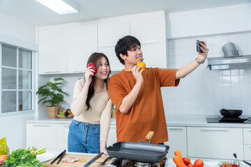 Happy of loving couple young asian Take a selfie with a smartphone of having fun standing a...