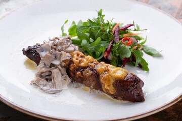 Grilled lamb chops with vegetables, served with herbs on white plate for restaurant menu