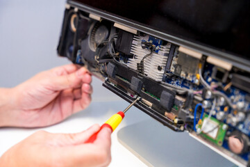 Technician fixing computer circuit board of a computer