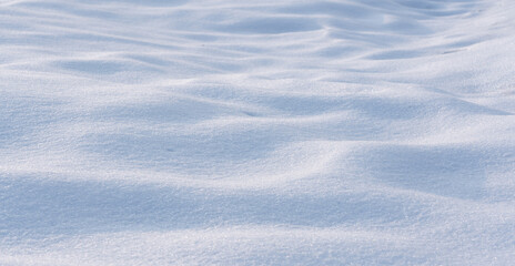 natural Snowdrift in sunny day. Nature Winter snow texture background.