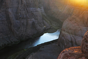 Aerial view of the river in the gorges of the mountains at sunset.