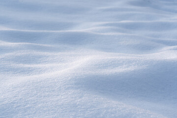 natural Snowdrift in sunny day. Nature Winter snow texture background.