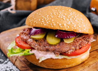 Close-up of home made burger on wooden tray