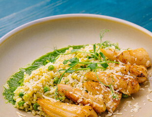 squids or octopus risotto with pesto sauce