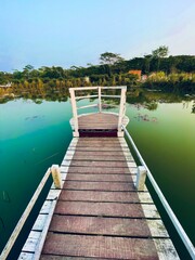 Naklejka premium wooden bridge over the lake