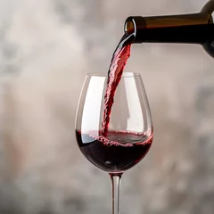 Fotobehang wine poured from a bottle into a glass. AI generative. © Dar1930