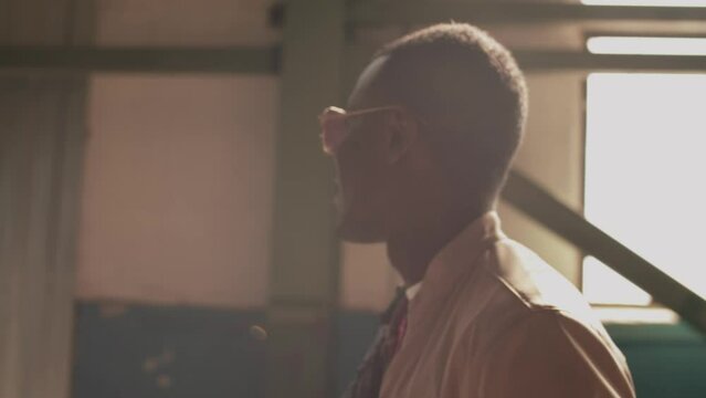 Fashion portrait footage of attractive man wearing aviator sunglasses smiling