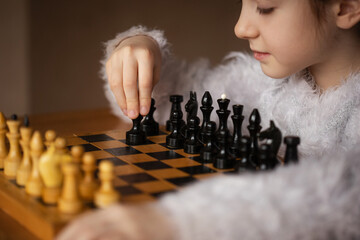 teaching children to play chess. board logic strategy game for developing mind
