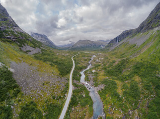 Aerial view of a mountain landscape with river and road in a u-shaped glacial valley in western...