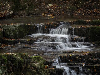 Fototapeta na wymiar The waterfall in green forest.