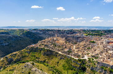Fototapeta na wymiar Matera, Italy. City in the Italian region of Basilicata, the administrative center of the province of Matera. The old part of the city is carved out of the rock and is a UNESCO. Aerial view
