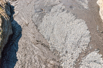 Top view of the bed of a fast mountain river