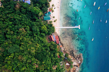 Top view or aerial view of fisherman village with white beach and boats in summer of tropical...