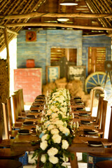 Floral wooden Dinner table setup in a barn house