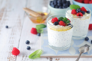 Greek yogurt in glasses with berries and quinoa	