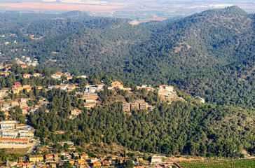 Villa in mountains. Mountains landscape with houses on hill. Towhouse and Home on hills. House in mountains. Rural landscape with hills. Houses on Mountain with nature scenery in Gilet Town in Spain.