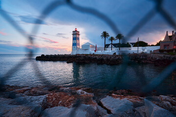 Farol Museu de Santa Marta. Lighthouse and Museum in Cascais, Portugal. Beautiful sunset on the sea...