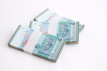 Malaysia Currency Ringgit 50: Stack of Ringgit Malaysia bank note on white background. Selective focus.