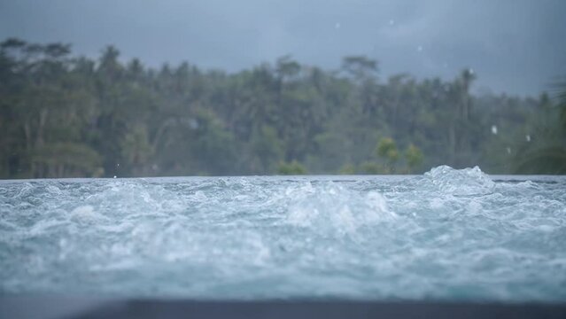 High definition slow motion footage of bubbles in the jacuzzi overlooking the jungle in Bali, Indonesia.
Medium angle, parallax movement.
