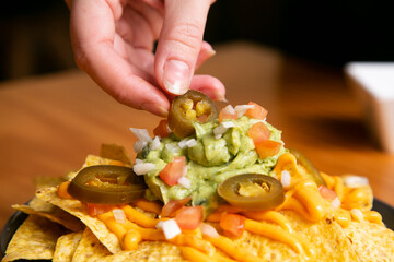 Nachos with guacamole and vegetables. Original Mexican recipe.