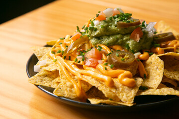 Nachos with guacamole and vegetables. Original Mexican recipe.