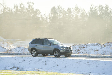 SUV Roams Snowy Path in Majestic Expedition. Conquering Winter Grip. Winter tires and a good car...