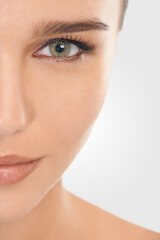 Fototapeta premium Beauty, portrait and girl for skincare with makeup for natural look, closeup and wellness for self care. Woman, dermatology and cosmetic in studio with mockup, facial and routine for healthy skin