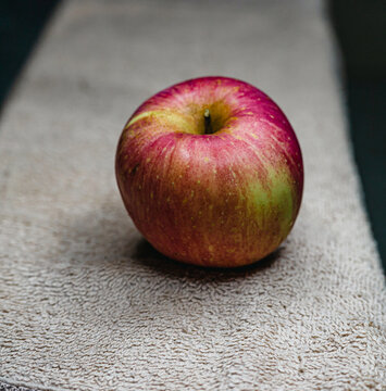 Close-up photo of a fresh and appetizing red apple shot from various angles 