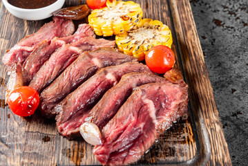 Cooked sliced beef steak rare with sauce