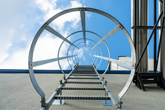 vertical aluminum escape ladder  entrance to the roof