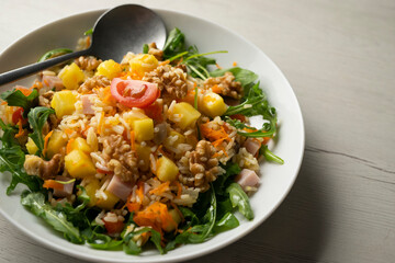 Rice salad with pineapple, walnuts and arugula.