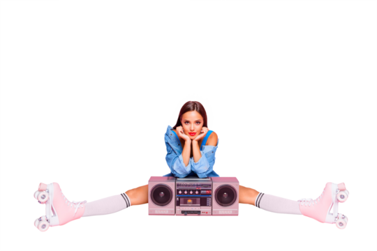 Full-size photo of excited beautiful lovely girl sitting on twine in rollers with a boombox isolated on pink vivid background