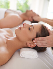 Couple, massage and hands on head in spa for luxury treatment for wellness on calm holiday or...