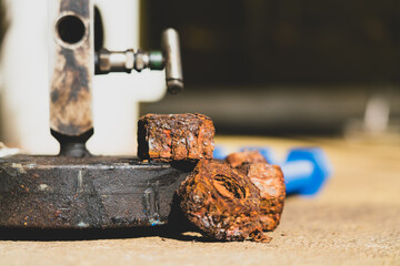 Corrosion on old threaded nuts used in the petroleum industry.