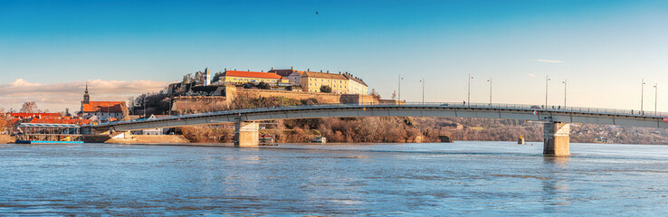 picturesque charm of Novi Sad as you stroll along the banks of the Danube, where the majestic river...