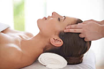 Head, massage and hands on woman in spa to relax on table for skin care, treatment or facial....