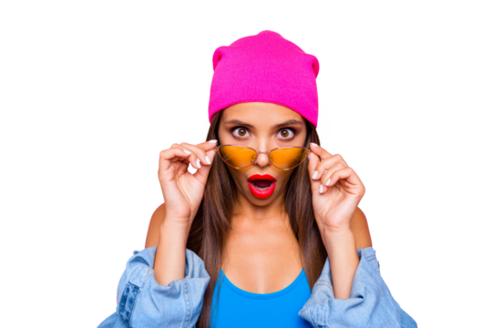 WOW! Close up portrait of shocked girl face looks over the glasses directly at the camera isolated on bright pink background - Powered by Adobe