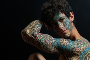 man with mandala inspired body paint posing