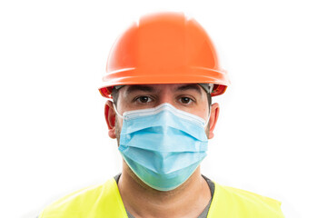 Close-up of constructor man in work attire wearing surgical mask