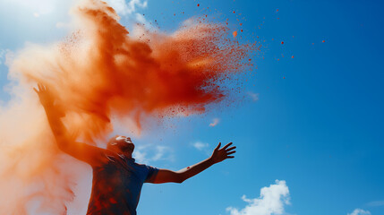 An indian man throwing gulaal in the air, holi celebration