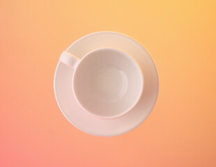 Modern interior design. White cup and plate for drinks.