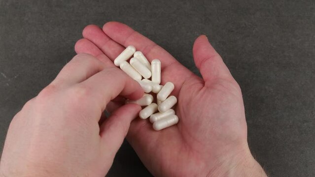 Magnesium chelate in capsules in hand