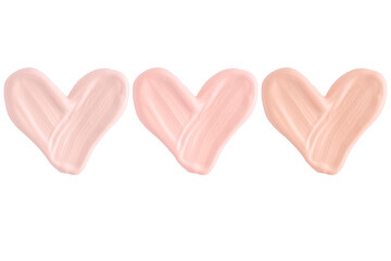 Smear of foundation cream or concealer in the shape of a heart isolated on white background, macro. Set of hearts from foundation cream smear texture different hue colors.