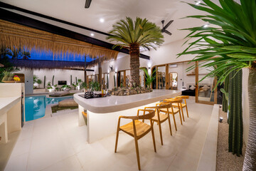 Dining table with pool view in luxury home